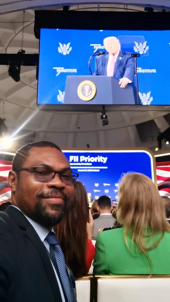 Mr. Gabriel MVOGO SAINT, listening attentively to the speech by President Donald J. Trump, the 45th and 47th President of the United States, at the FII PRIORITY MIAMI 2026
